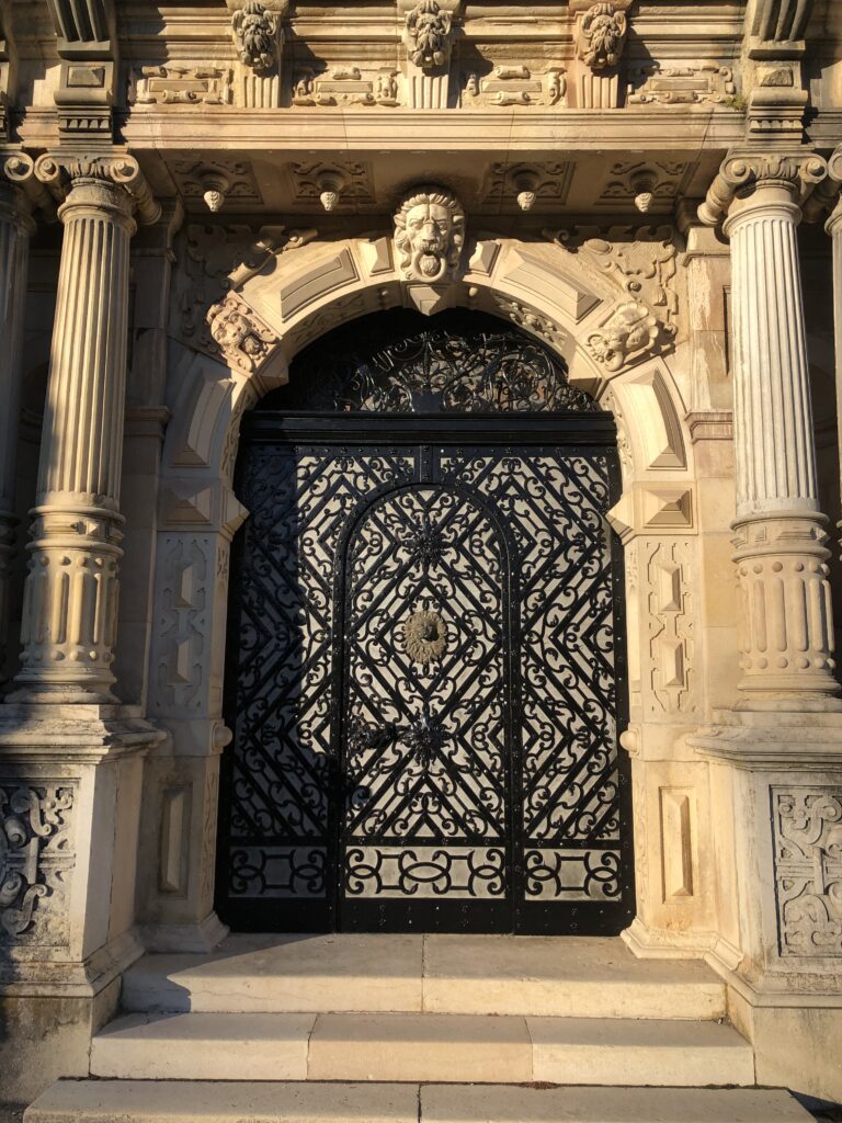 Peles Castle courtyard door, autism travel blog