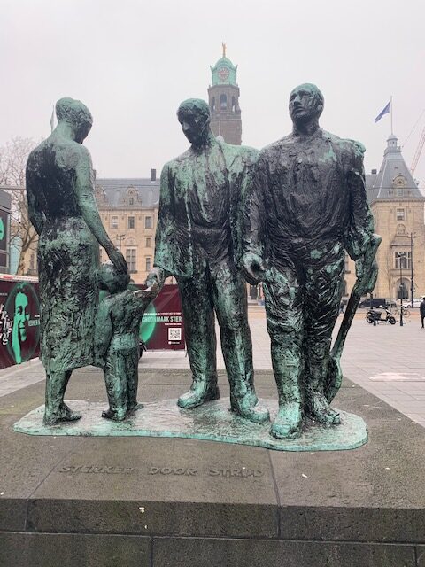 3 bronze men statue, Europe travel, autistic advocate